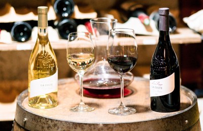 bottles and glasses of wine from the estate of Château La Coste