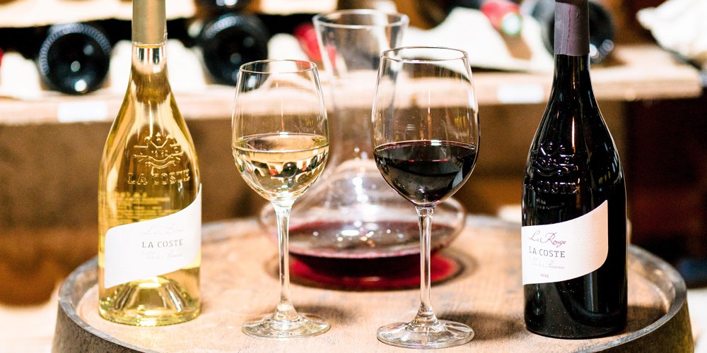 bottles and glasses of wine from the estate of Château La Coste